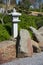Stone lantern, rock and raked gravel, zen garden landscape design in Japanese style