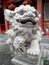 Stone lion on the main facade of the Vihara Gunung Timur temple in Medan