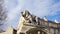 Stone lion sculpture, oldest street in the capital of Spain, the city of Madrid. Stock. Lion statue in the middle of a