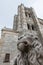 Stone lion and tower of the cathedral of Avila