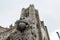 Stone lion and tower of the cathedral of Avila