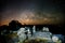 Stone lodge on night sky stars background