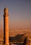 Stone long minaret of mosque at Mardin.