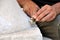 Stone mason at work carving an ornamental relief