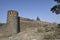 Stone masonry wall with Cylindrical watch towers at intervals surrounding entire village of  Vitthal Temple, Palashi, Parner,