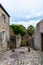 Stone medieval houses in cobblestoned street in Dinan