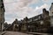 Stone medieval houses in cobblestoned street in Dinan