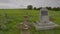 A stone memorial set in a large field