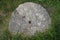 Stone millstone. Tools of the past. Granite. Household items of the past centuries. Story.