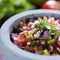 Stone molcajete with mexican pico de gallo salsa