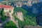 Stone monastery in the mountains. Kalabaka, Greece summer cloudy day in Meteora mountain valley.