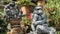 Stone monkeys statues in sacred monkey forest. Old decorative monkey sculptures in Bali ubud sacred forest