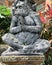 Stone monkeys statues in sacred monkey forest. Old decorative monkey sculptures in Bali ubud sacred forest