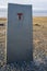 Stone monument at beginning of international hiking trail