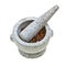 Stone mortar and pestle with crushed pepper