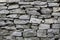 Stone natural rock texture background. Modern grunge wall castle made old granite of blocks. Wall rough old piece rock of mountain