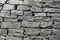 Stone natural rock texture background. Modern grunge wall castle made old granite of blocks. Wall rough old piece rock of mountain