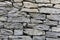 Stone natural rock texture background. Modern grunge wall castle made old granite of blocks. Wall rough old piece rock of mountain