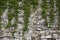 Stone old wall with heather. Stone wall texture. Rock blocks in old medieval brick.