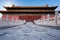 Stone ornament panel with dragons in front of the ancient red pavilion. view from the ground. The Imperial Palace in Beijing