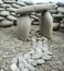 Stone path, gates and wall composed of small rocks