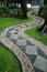 Stone path on the green grass.