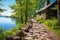 stone path leading to a lakeside cabin