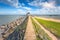 Stone path leading to the lighthouse on the sea coast