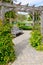 Stone Path Under Wooden Arbor