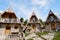 Stone paths lead to two-storey triangular houses. Montenegro