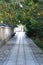 A stone paved alley path with a calm atmosphere.