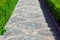 A stone paved footpath with a pattern close up.