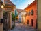 Stone paved medieval streets with colorful houses in Sighisoara, Transylvania region, Romania