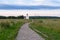 The stone-paved trail through the Bogolubovo meadow towards Church of the Intercession of the Holy Virgin on the Nerl River.