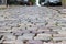 Stone pavement in perspective. Artistic texture and background. Element of the old street of the city of Lviv in Ukraine. Outdoor