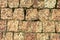 The stone pavement. Texture of stones on road closeup. Part of a road paved with square stones of red granite.