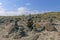 Stone pebble cairns on a sandy beach