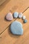 Stone Pebbles composed as human foot trace on wooden floor