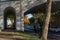 Stone pedestrian archway under old Riviera bridge with roadway in resort Sochi town. Favorite tourist route for walk along embankm