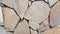 Stone pieces mosaic wall background. Rough stone textured background.