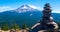 Stone pile in front of distant Mt Hood