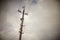 Stone pillar with many wires in cloudy sky background