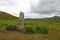 Stone pillar in the middle of the steppe. Archaeological monument.