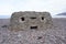 Stone pillbox defence on English beach