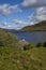 The stone pitched roof of an abandoned Boathouse lies hidden on the side of Loch Lee.