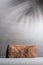 Stone podium for product display with palm leaves shadow on background