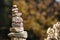 Stone pyramid in front of dark green blurry background