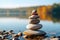 Stone pyramid. Pebbles balance pile, harmony zen stones, balance stack, sea pebble pyramid on shoreline, relaxation