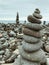 Stone pyramid, stacked pebble stones, black stacked volcano stones