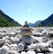 Stone pyramids, little man, mound, ovoo, Inukshuk in the blue sky